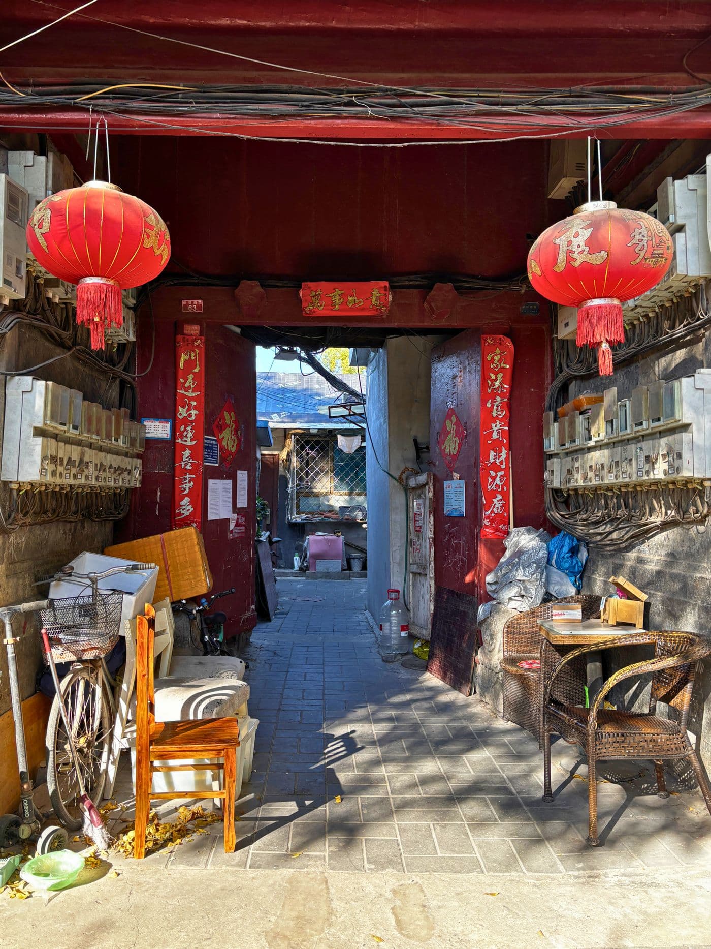 Beijing hutong entrance with red lanterns